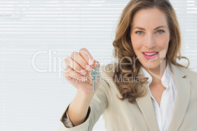 Portrait of a beautiful woman holding house keys