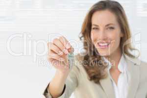 Portrait of a beautiful woman holding house keys