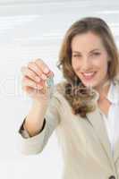 Portrait of a beautiful woman holding house keys