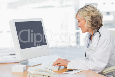 Female doctor using computer in medical office