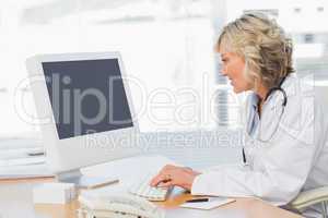 Female doctor using computer in medical office