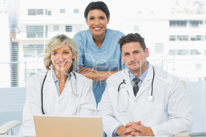 Doctors with laptop at the medical office