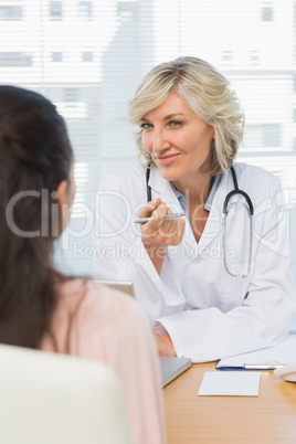 Friendly female doctor in conversation with patient