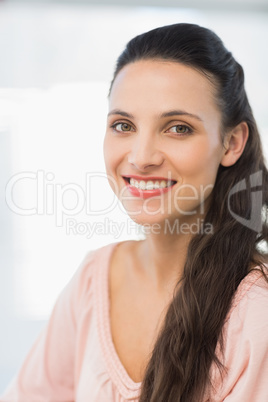 Close-up portrait of a smiling young businesswoman