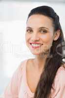Close-up portrait of a smiling young businesswoman
