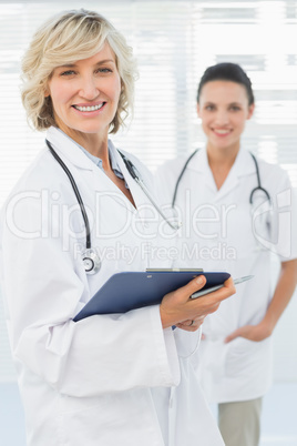 Portrait of a beautiful female doctor with clipboard