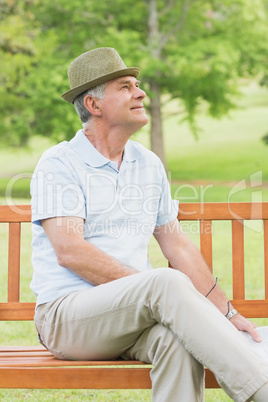 Senior man sitting on bench at park