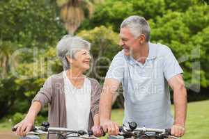 Senior couple on cycle ride at park