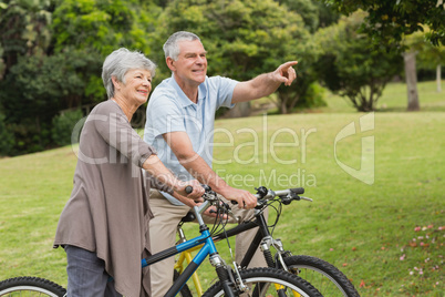 Senior couple on cycle ride in countryside