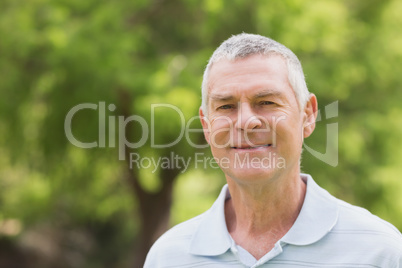 Portrait of a smiling senior man at park