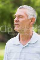 Close-up of a serious senior man at park