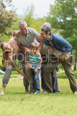 Family playing in park