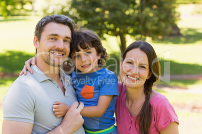 Portrait of a couple with little son at park