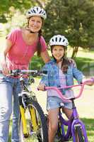 Woman with her daughter riding bicycles