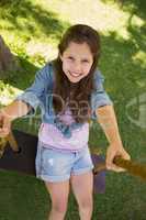 Cute little young girl on swing