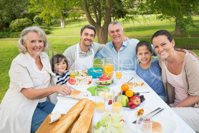 Extended family dining at outdoor table