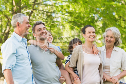 Portrait of cheerful extended family in park