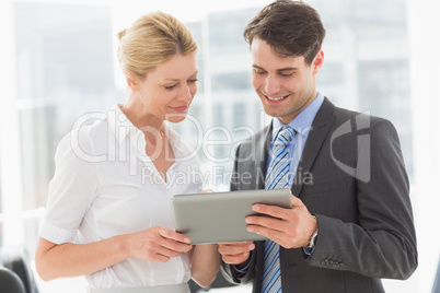 Business team looking at tablet pc together