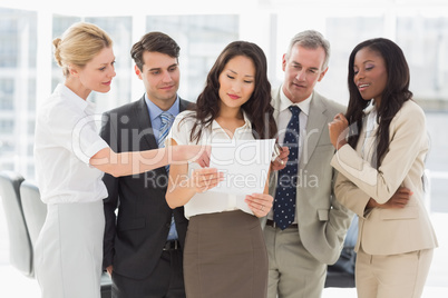 Business team looking at document together