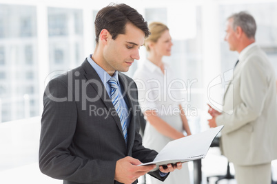 Businessman reading over a document