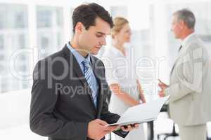 Businessman reading over a document