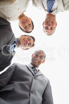 Business team smiling down at the camera