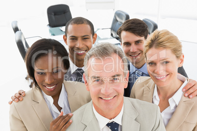 Diverse business team smiling up at camera