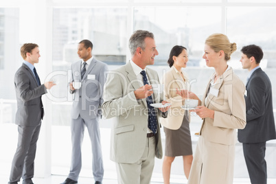 Business people chatting at a conference