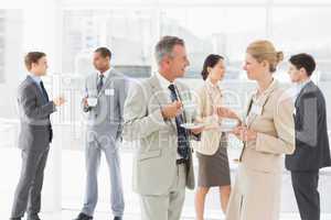 Business people chatting at a conference