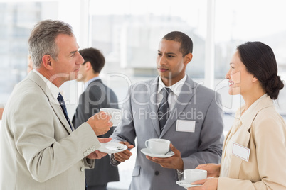 Business people talking and having coffee at a conference