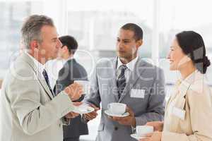 Business people talking and having coffee at a conference
