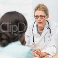 Concerned doctor talking to her patient