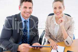 Smartly dressed colleagues in business meeting