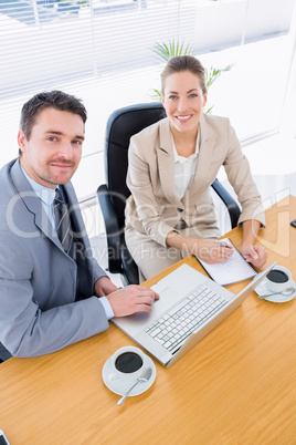 Smartly dressed colleagues in business meeting