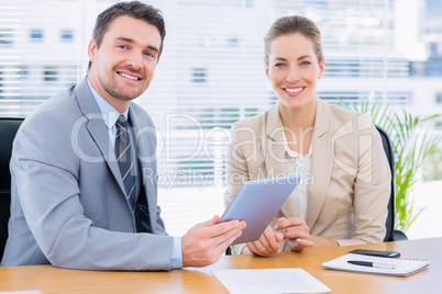 Smartly dressed colleagues in business meeting