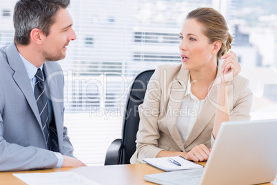 Smartly dressed colleagues in business meeting