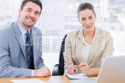 Smartly dressed colleagues in business meeting