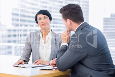 Smartly dressed colleagues in business meeting