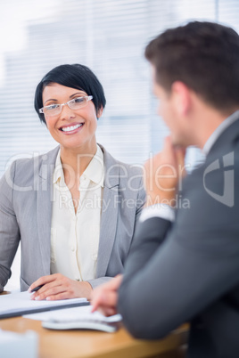 Smartly dressed colleagues in business meeting