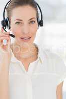 Close-up of a beautiful female executive with headset