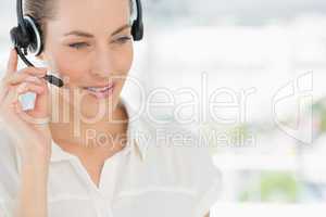 Close-up of a beautiful female executive with headset