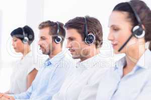 Group of business colleagues with headsets in a row