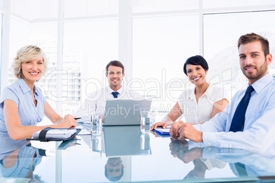 Executives sitting around conference table