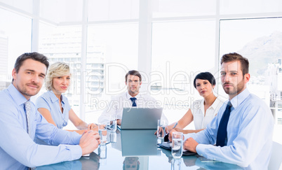 Executives sitting around conference table