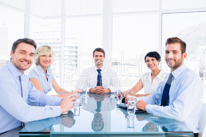 Executives sitting around conference table