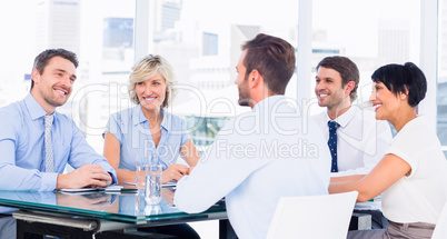 Executives sitting around conference table