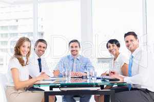 Executives sitting around conference table