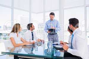 Executives sitting around conference table