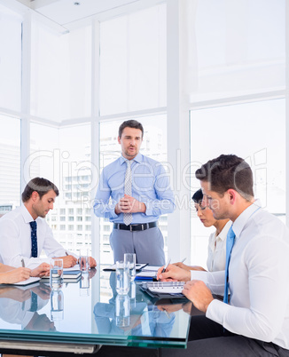 Executives sitting around conference table