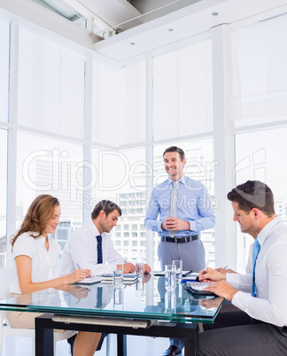 Executives sitting around conference table